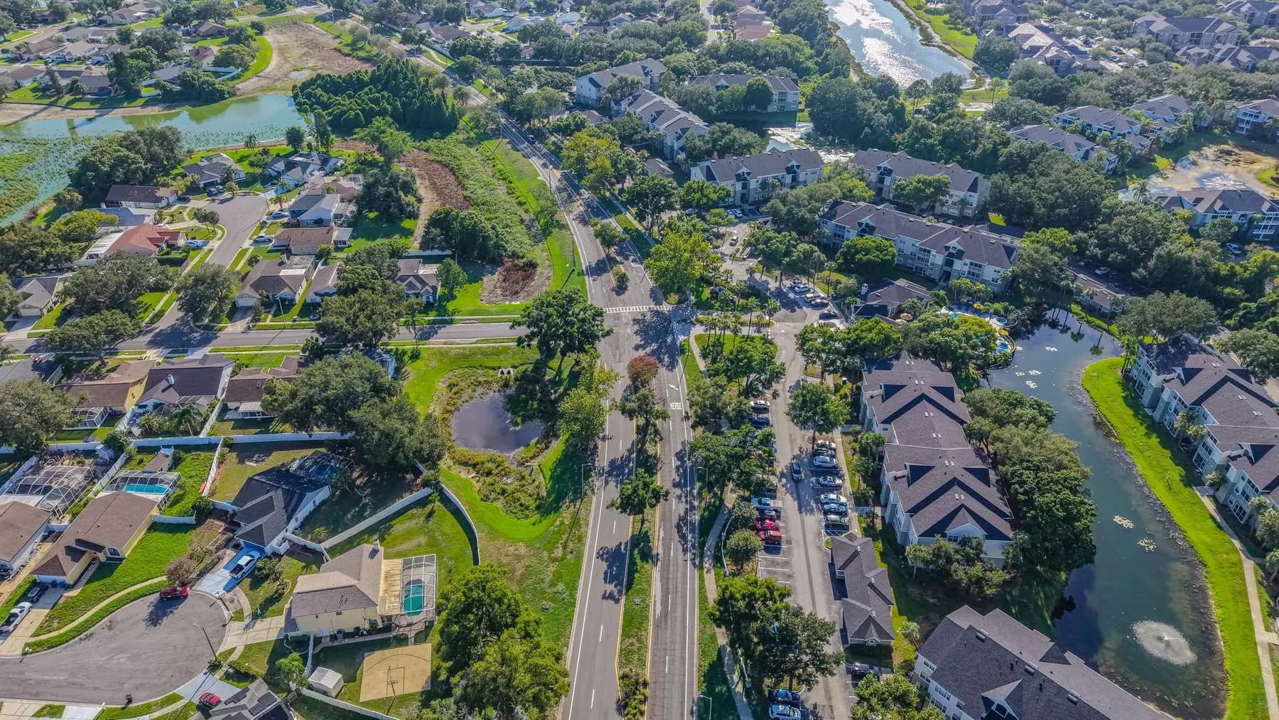 Aerial view of a Florida residential neighborhood with ponds and tree cover
