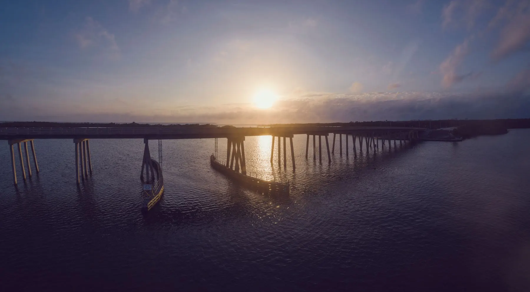 Bridge over the water at Fort Myers Beach at sunset