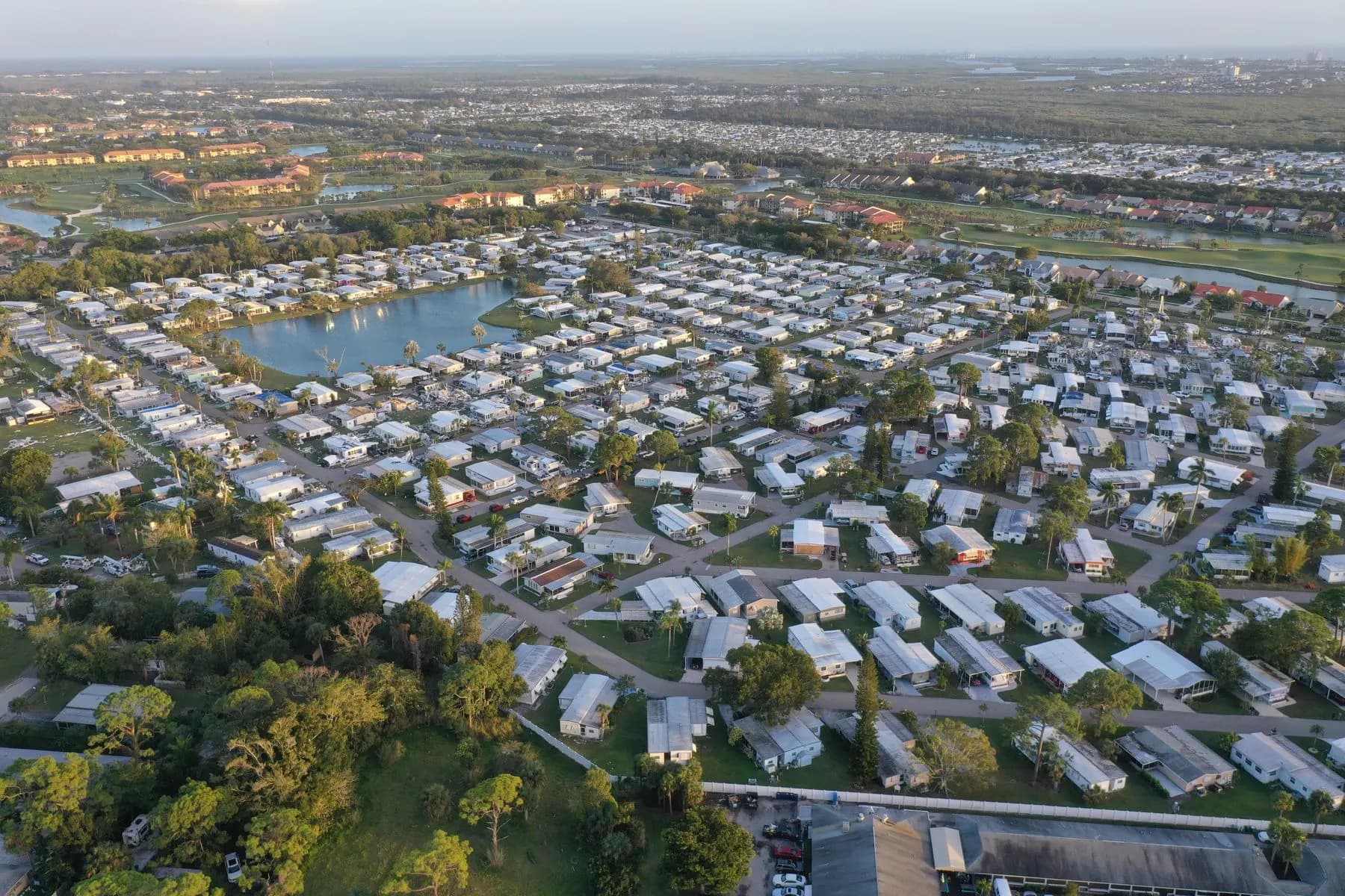 Aerial view of a residential neighborhood in Fort Myers, Florida, with lakes and tree lined streets